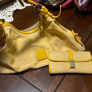 Used Yellow Dooney and Bourke purse and matching Billfold